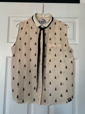 Drop Dead Sleeveless Cream Blouse with Black Trim and Bow Tie